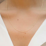 Yellow gold chain necklace with ring clasp worn by model