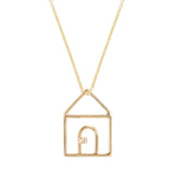 Gold chain necklace with house shaped pendant and small diamond
